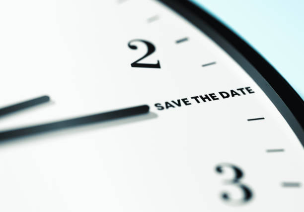Save The Date Time. The time on the wall clock is showing Save The Date. Time, deadline and Planning Concept. Close Up Wall Clock And Time is passing.