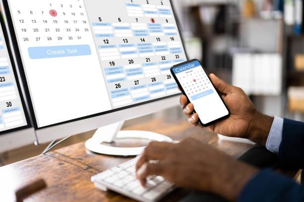 Man Organizing Appointment Schedule Using Scheduling Assistant