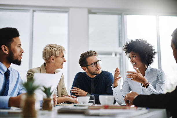 Shot of a group of businesspeople sitting together in a meeting (executive meeting).