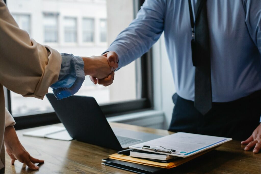 successful deal. two businessmen are shaking hands.