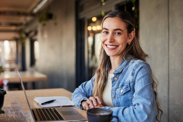 Portrait, relax and laptop with woman in cafe for planning, networking and remote work. Technology, website and social media with freelancer girl in coffee shop for study, research and blogging