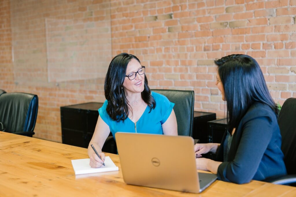 Two ladies have brief meeting