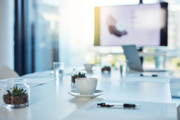 Shot of an empty boardroom in a modern office. For morning meetings.