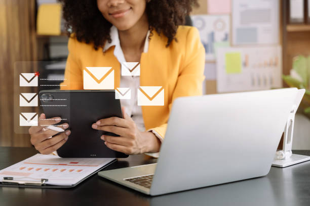 Woman, laptop and open emails: Email Deliverability